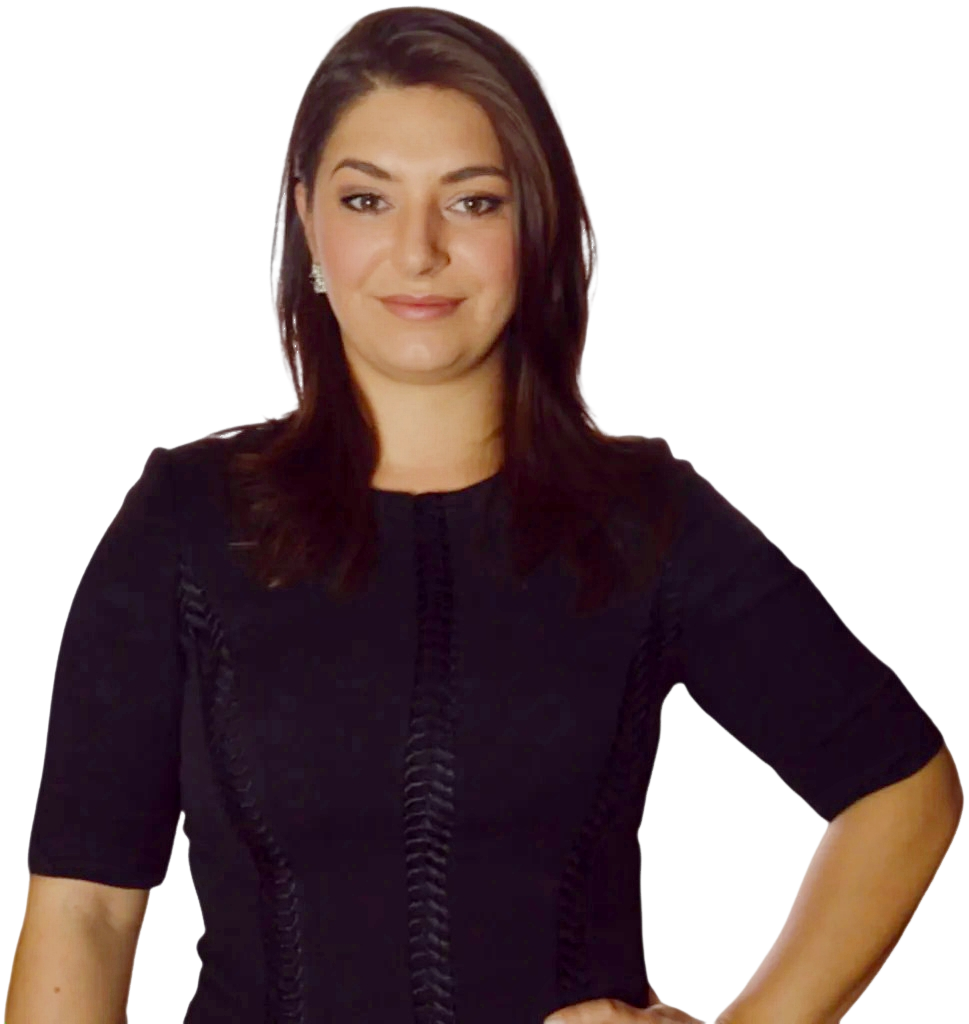 Sonia Gomez, speaker and mentor, wearing a black dress, smiling confidently, promoting investment opportunities and personal growth.